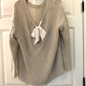 Back-tie cream sweater
